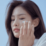 Woman applying Celimax Dual Barrier Watery Sun Cream SPF50+ PA++++ for daily UV protection