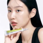 Beauty portrait featuring Celimax Vita-A Retinal Shot Tightening Booster 15ml highlighting a radiant skincare routine for healthy-looking skin.