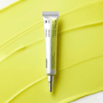 Celimax Vita-A Retinal Shot Tightening Booster 15ml displayed on a retinal-inspired cream texture background for firm-looking and smoother skin.