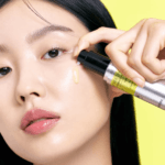Applying Celimax Vita-A Retinol Shot Tightening Serum 30ml to facial skin during a nighttime skincare routine.